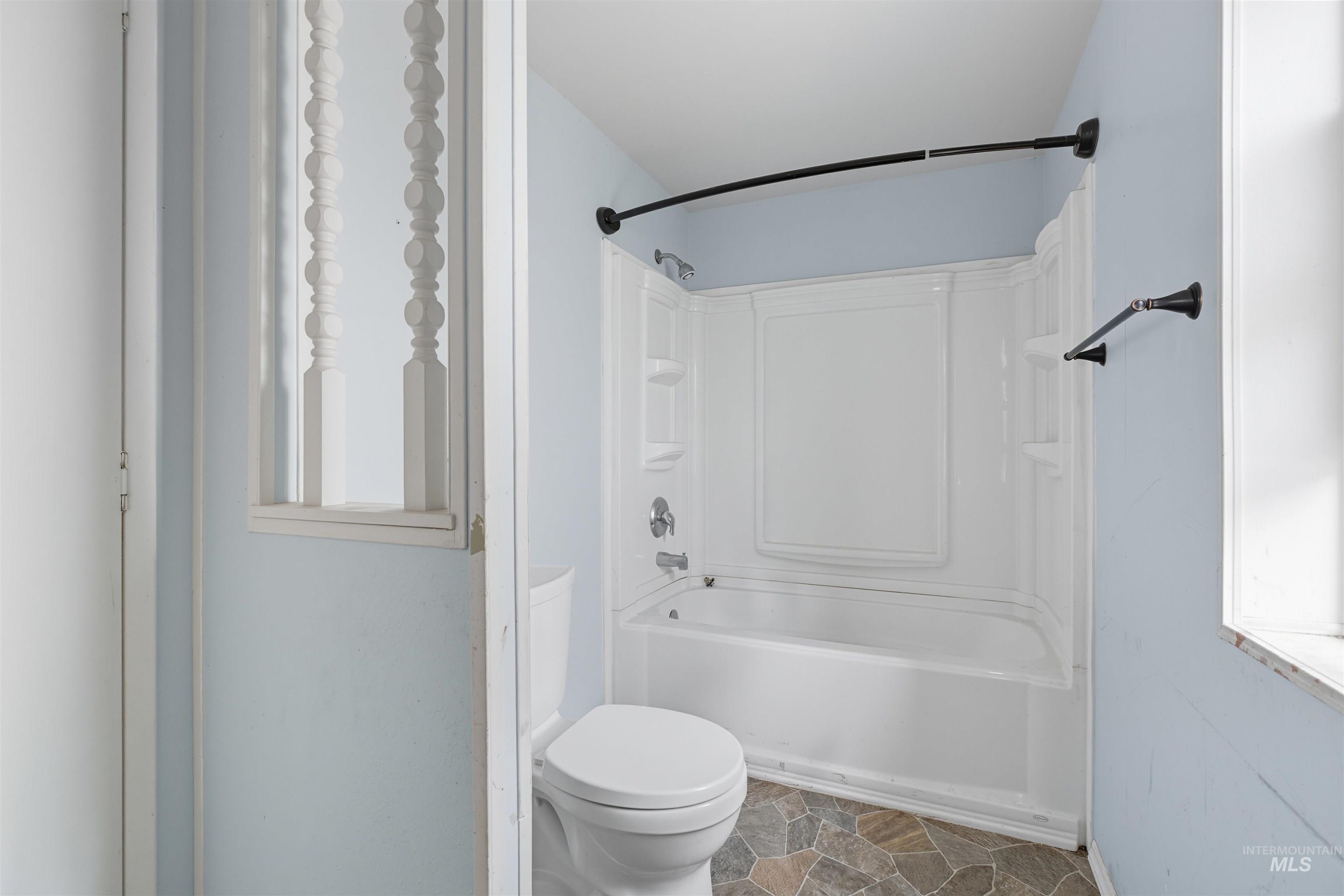 609 North Almon Street, Unit 2003 Moscow, ID 83843 - Photo 14 of 18 Bathroom featuring bathtub / shower combination and stone finish floors