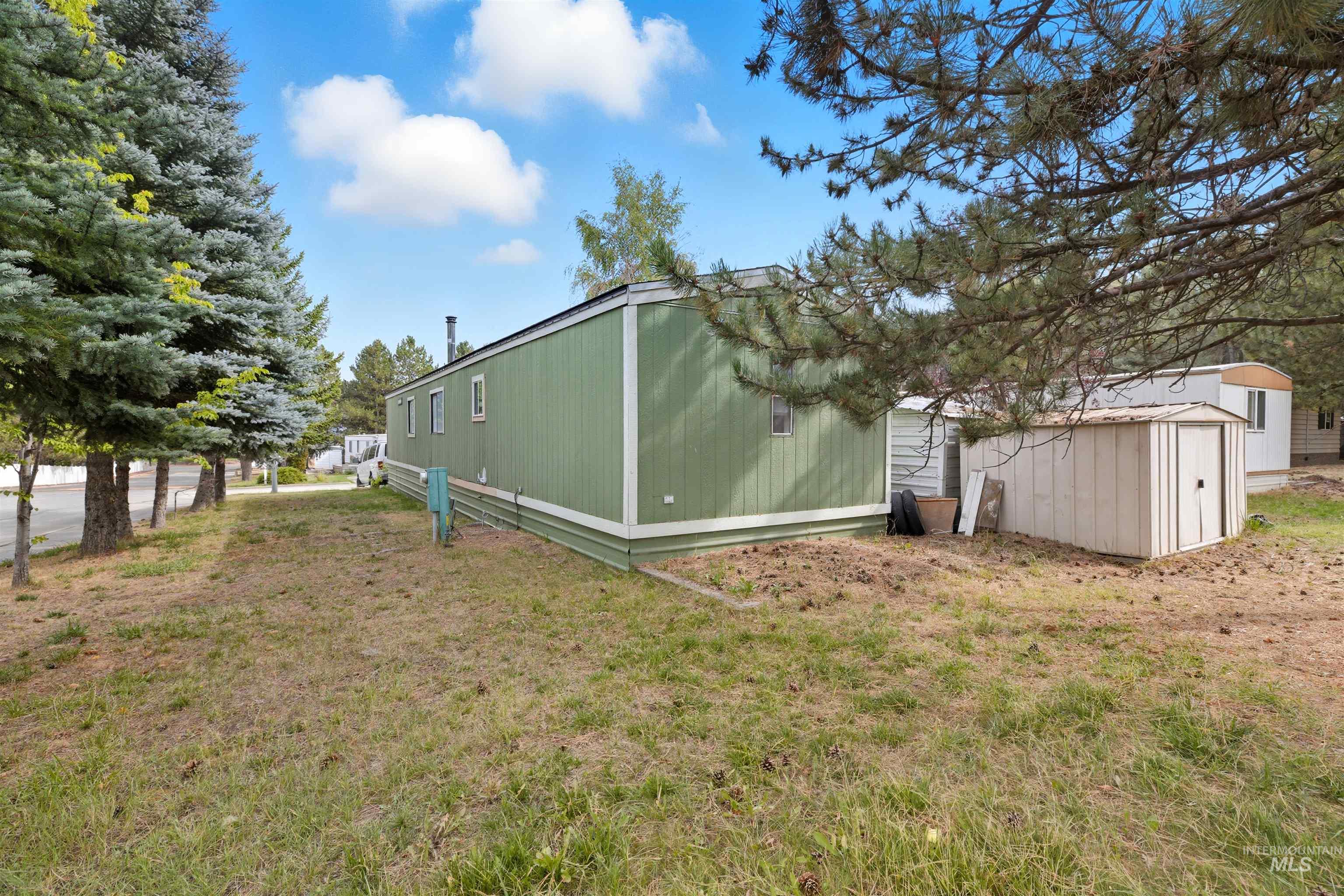 609 North Almon Street, Unit 2003 Moscow, ID 83843 - Photo 18 of 18 View of grassy yard featuring a storage unit