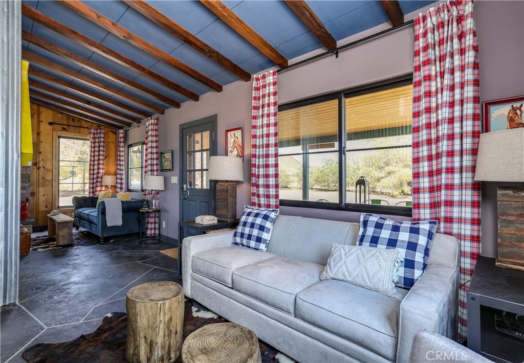 5969 Lorraine Road Yucca Valley, CA 92285 - Photo 14 of 45 a living room with furniture and a large window