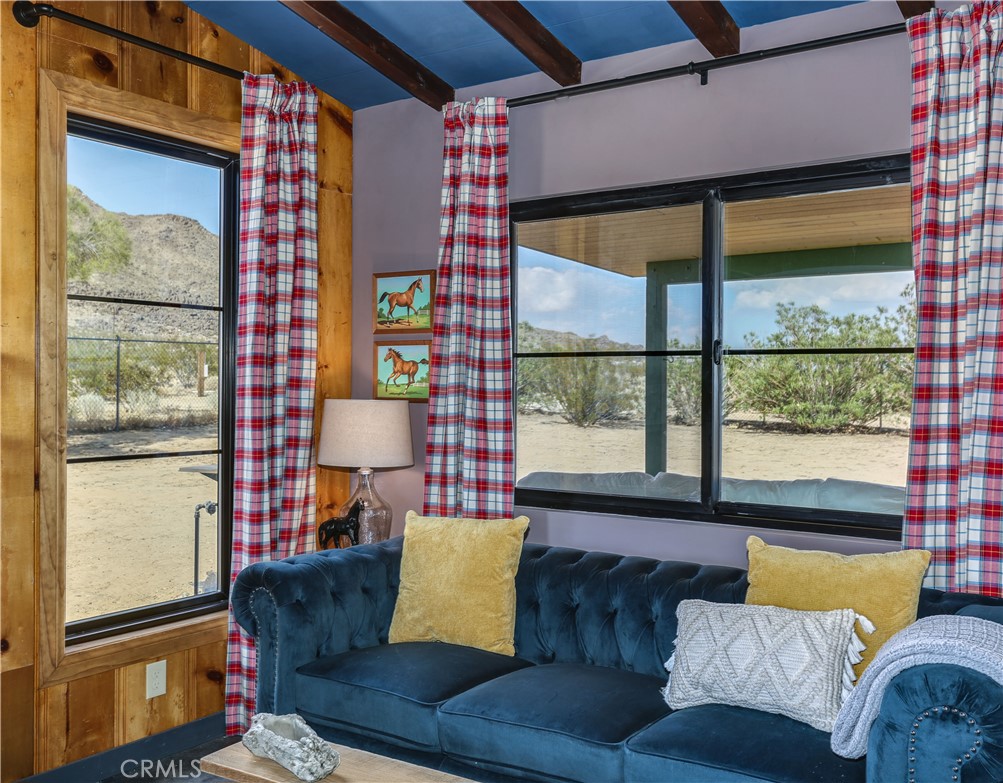 5969 Lorraine Road Yucca Valley, CA 92285 - Photo 17 of 45 a living room with furniture and a window