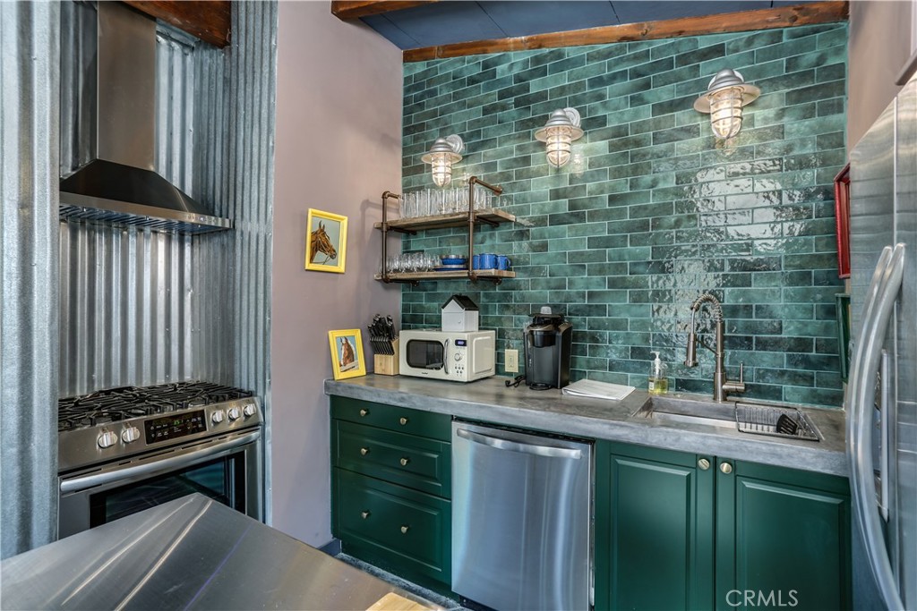 5969 Lorraine Road Yucca Valley, CA 92285 - Photo 2 of 45 a kitchen with granite countertop a sink stove and cabinets