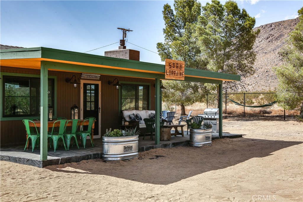 5969 Lorraine Road Yucca Valley, CA 92285 - Photo 5 of 45 a view of a building with sitting area