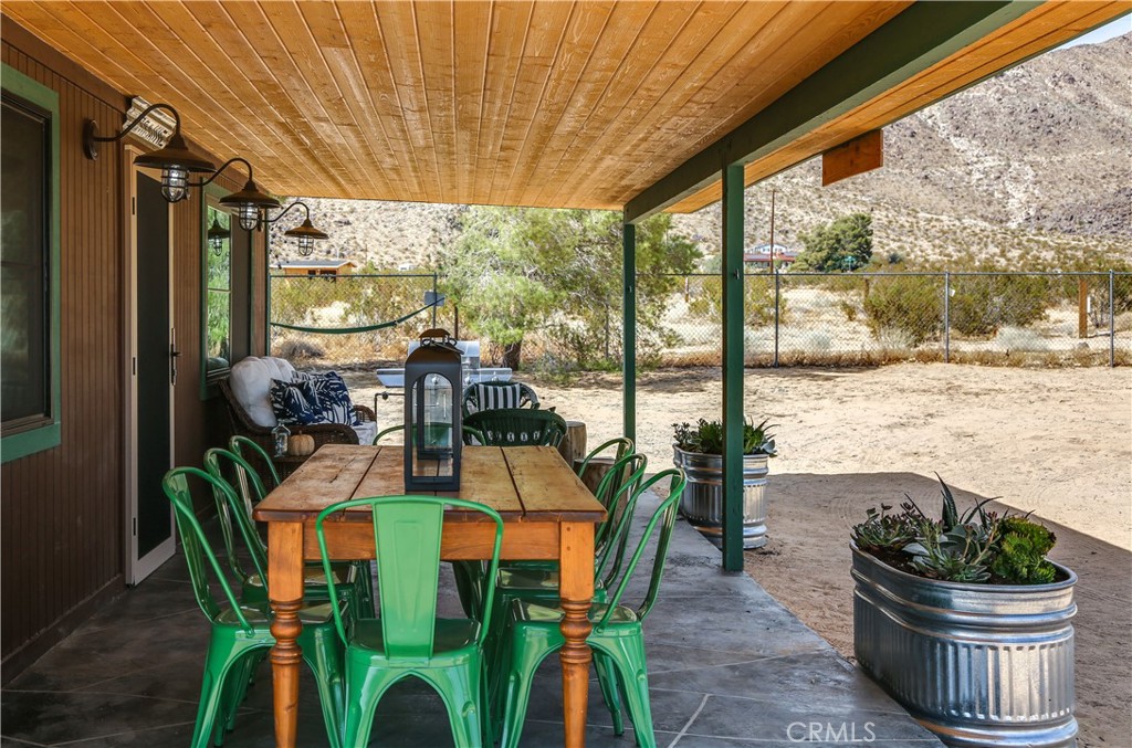 5969 Lorraine Road Yucca Valley, CA 92285 - Photo 10 of 45 a view of an outdoor dining space with a table and chairs