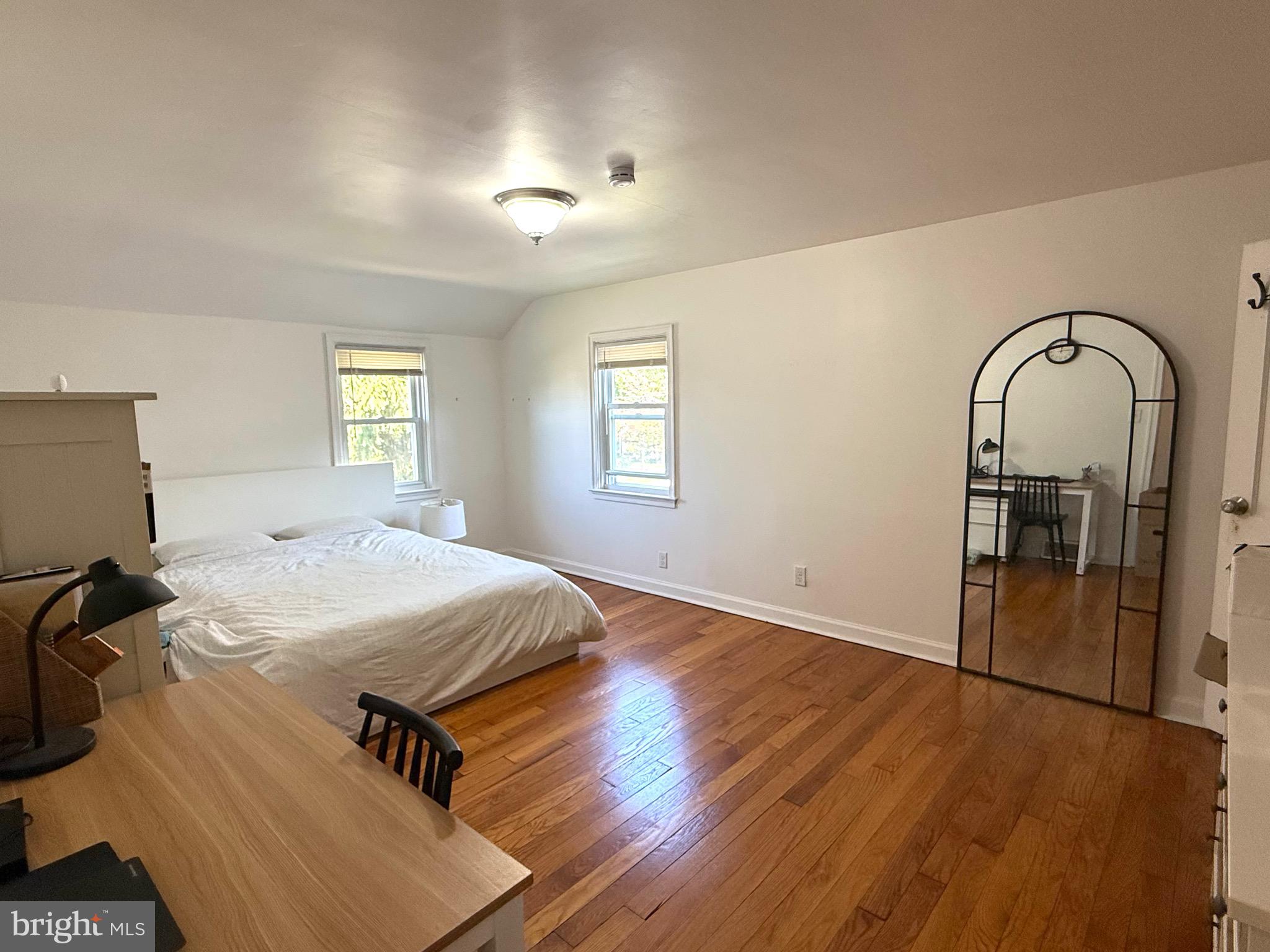 1510 Wynnewood Road Ardmore, PA 19003 - Photo 11 of 20 a spacious bedroom with a bed and wooden floor