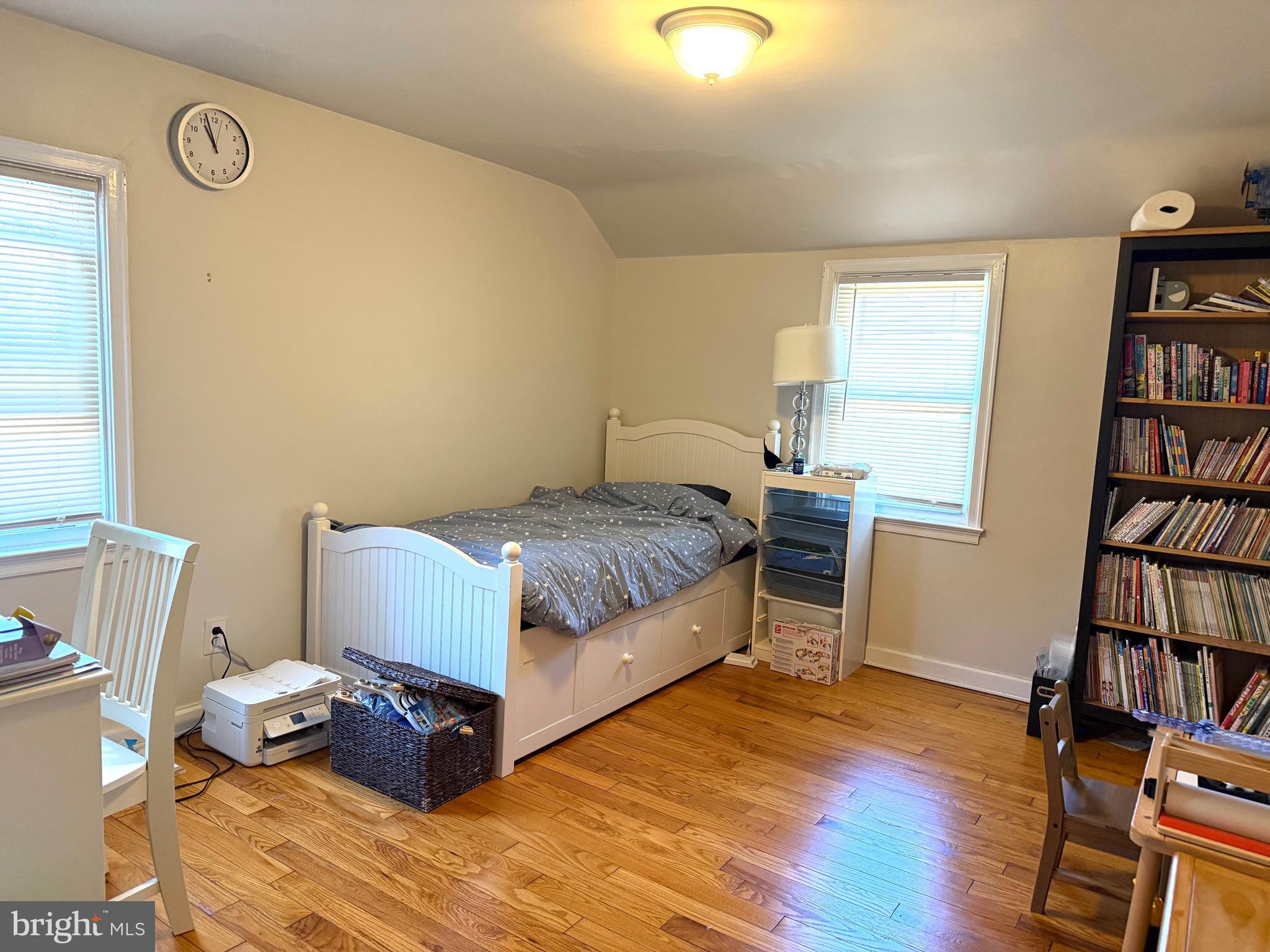 1510 Wynnewood Road Ardmore, PA 19003 - Photo 12 of 20 a bedroom with a bed and a book shelf