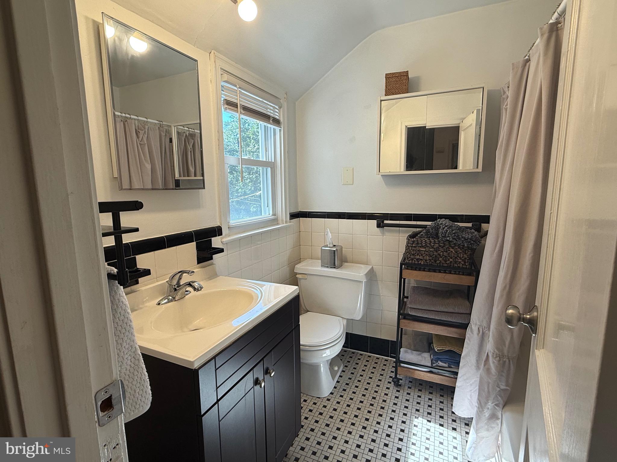 1510 Wynnewood Road Ardmore, PA 19003 - Photo 14 of 20 a bathroom with a sink toilet and mirror