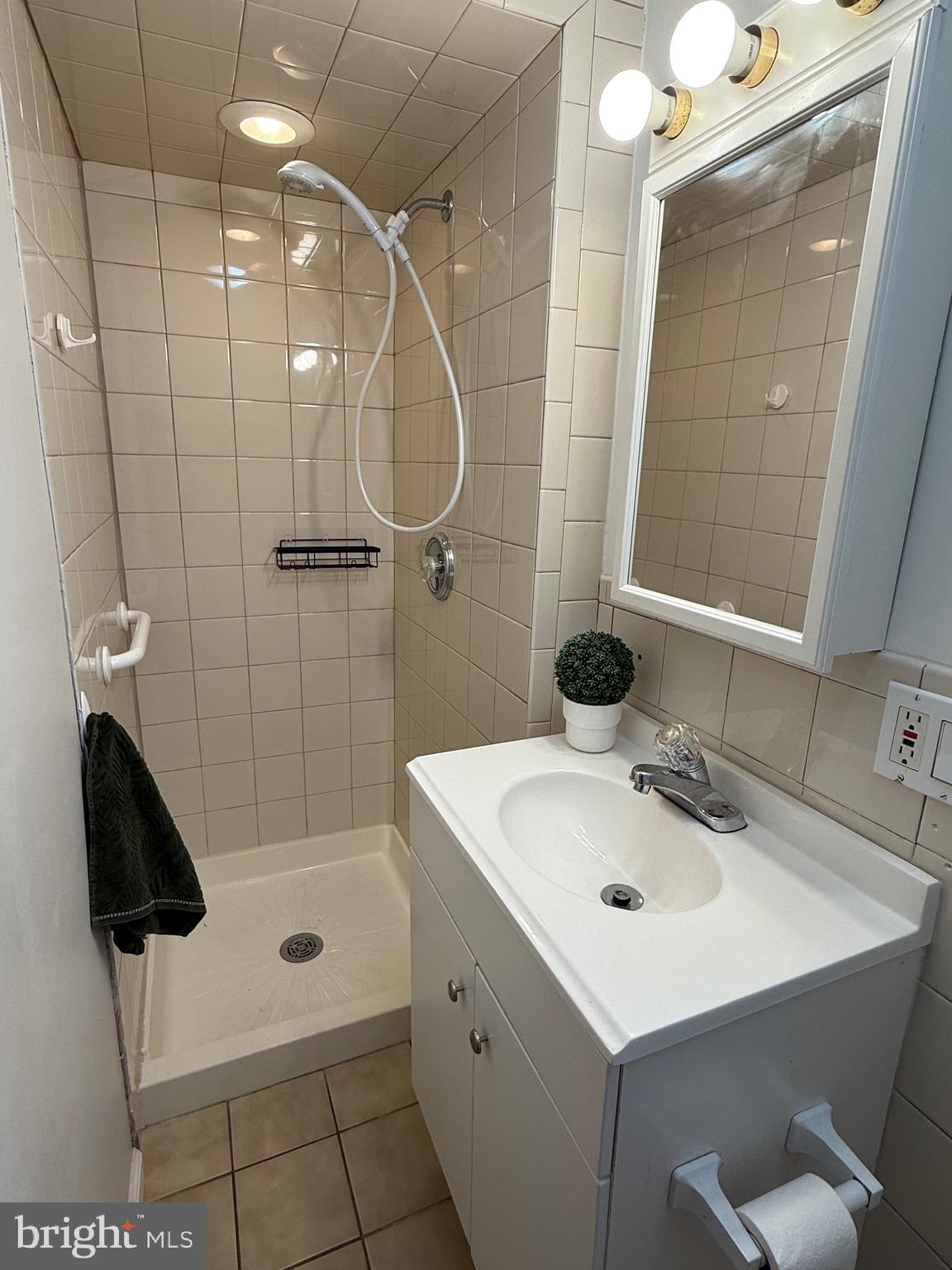 1510 Wynnewood Road Ardmore, PA 19003 - Photo 10 of 20 a bathroom with a sink a toilet and shower