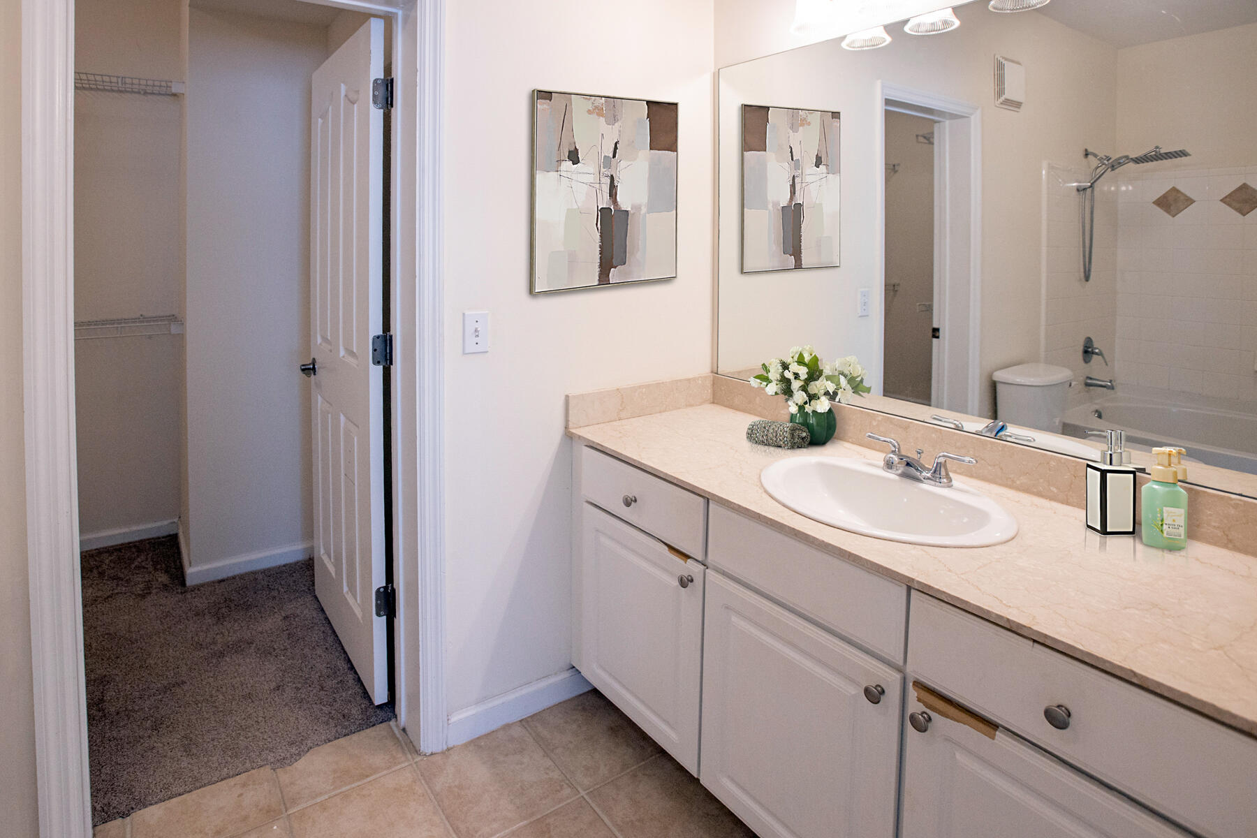 175 Galicia Way, Unit 210 Jupiter, FL 33458 - Photo 14 of 17 a bathroom with a sink and a mirror