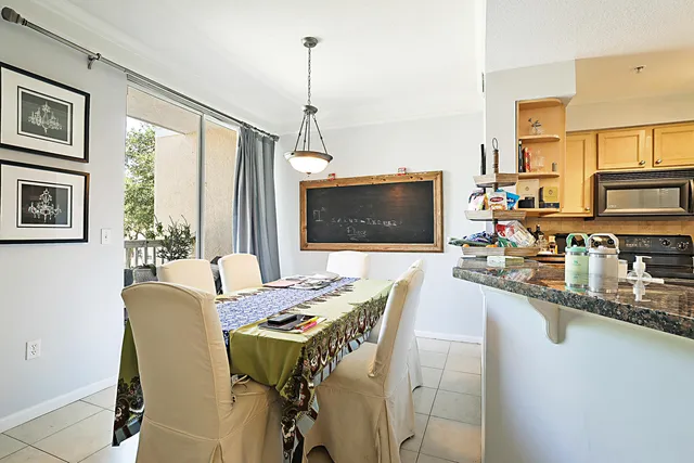 a view of a dining room with furniture window and outside view