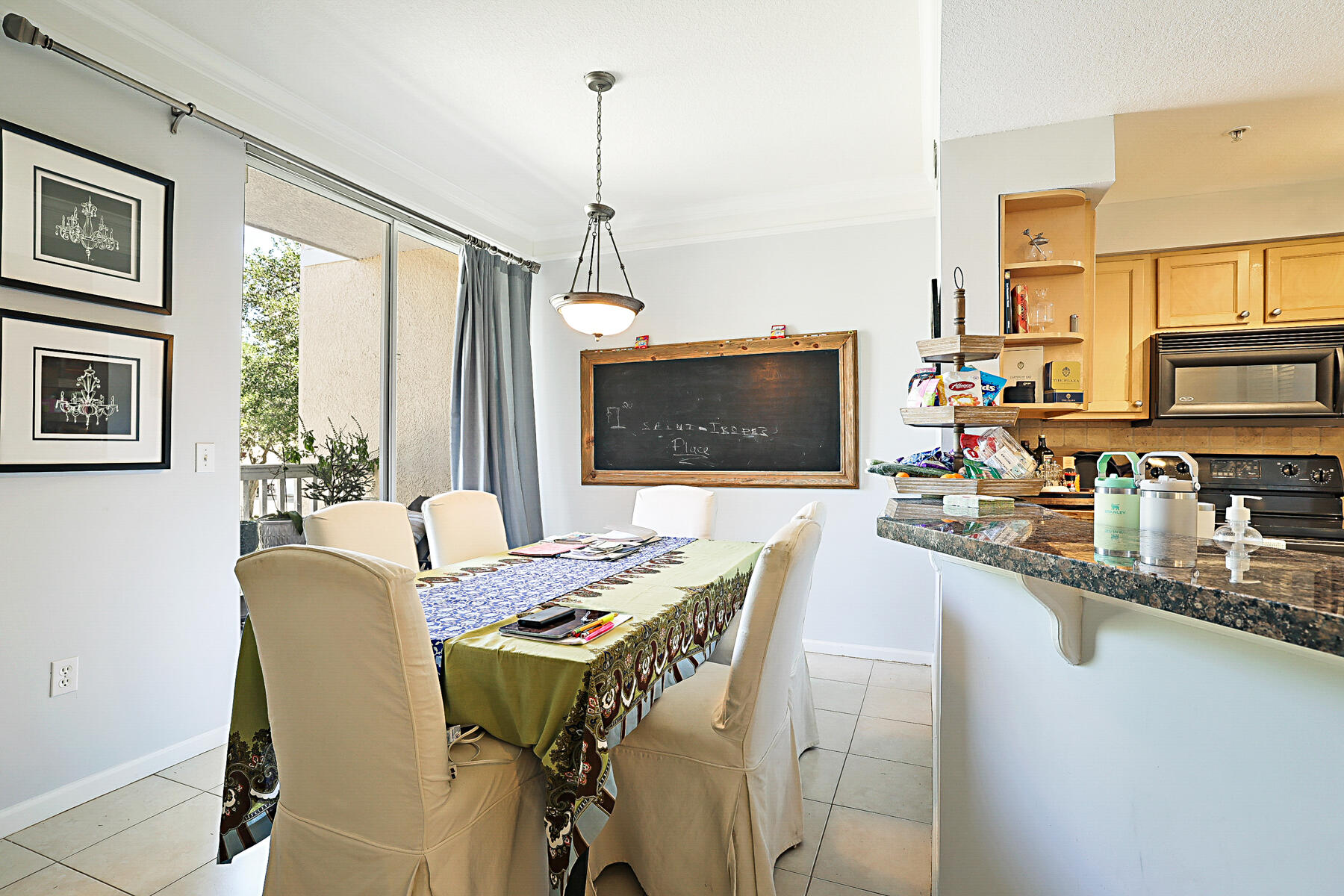 175 Galicia Way, Unit 210 Jupiter, FL 33458 - Photo 5 of 17 a view of a dining room with furniture window and outside view