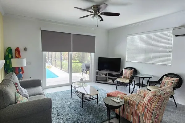 a bedroom with a bed and large window