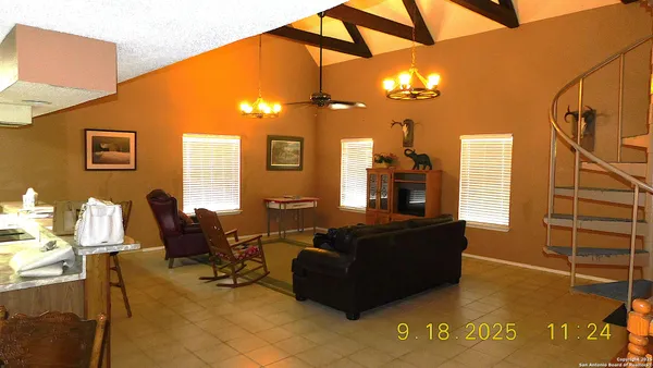 a bedroom with a bed and a chair