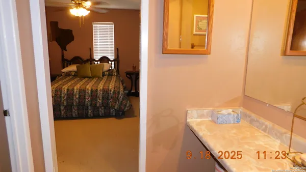 a view of staircase with railing and a chandelier