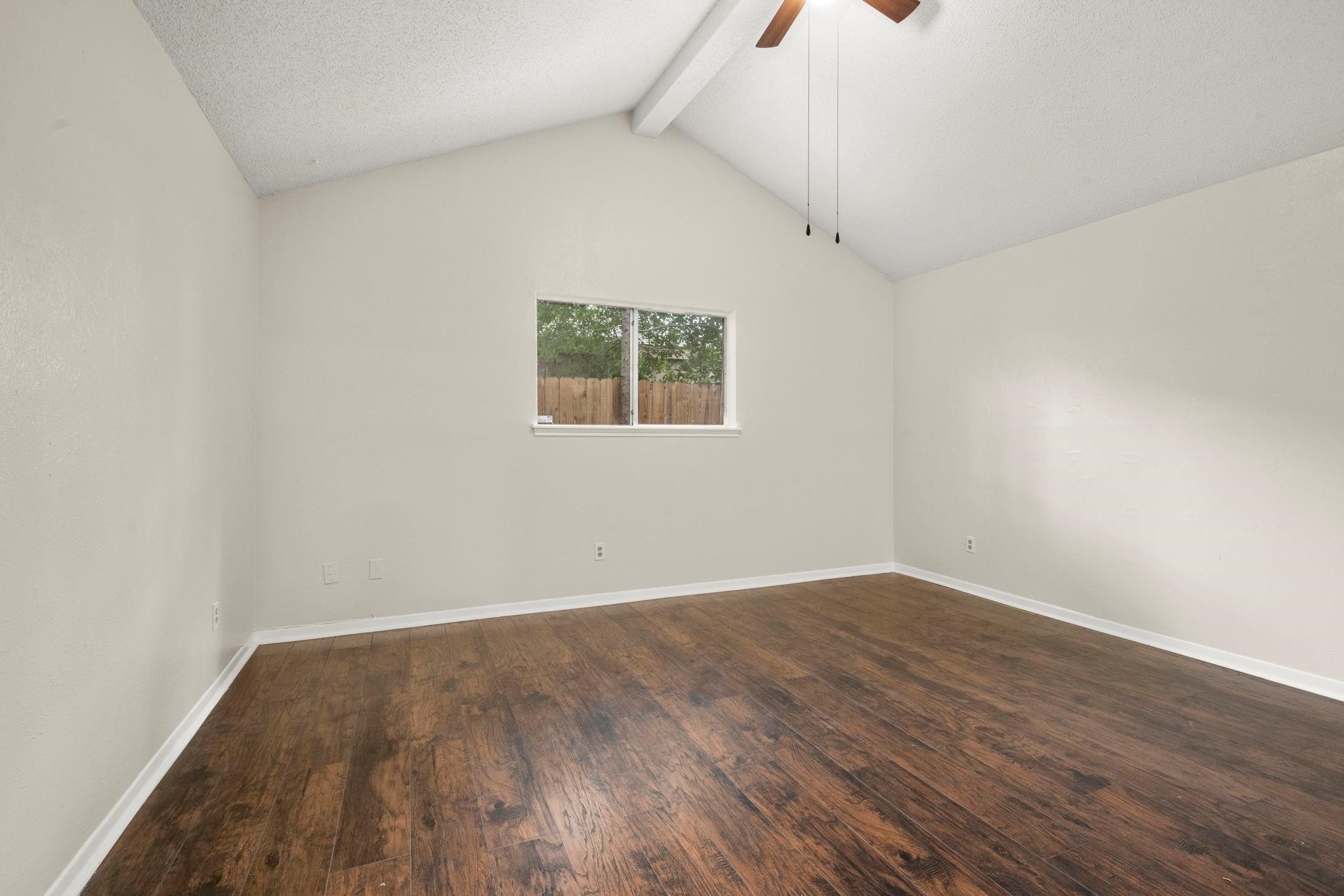 11718 Ridge Run Drive Houston, TX 77064 - Photo 13 of 17 an empty room with wooden floor and windows