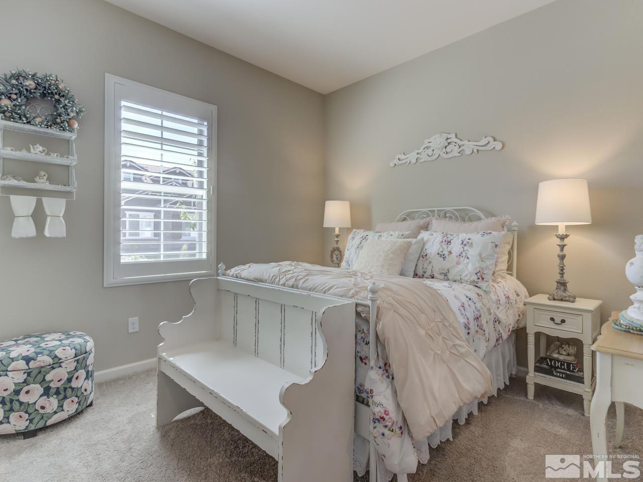 9465 Baldacci Road Reno, NV 89521 - Photo 17 of 25 a bedroom with a bed and a window