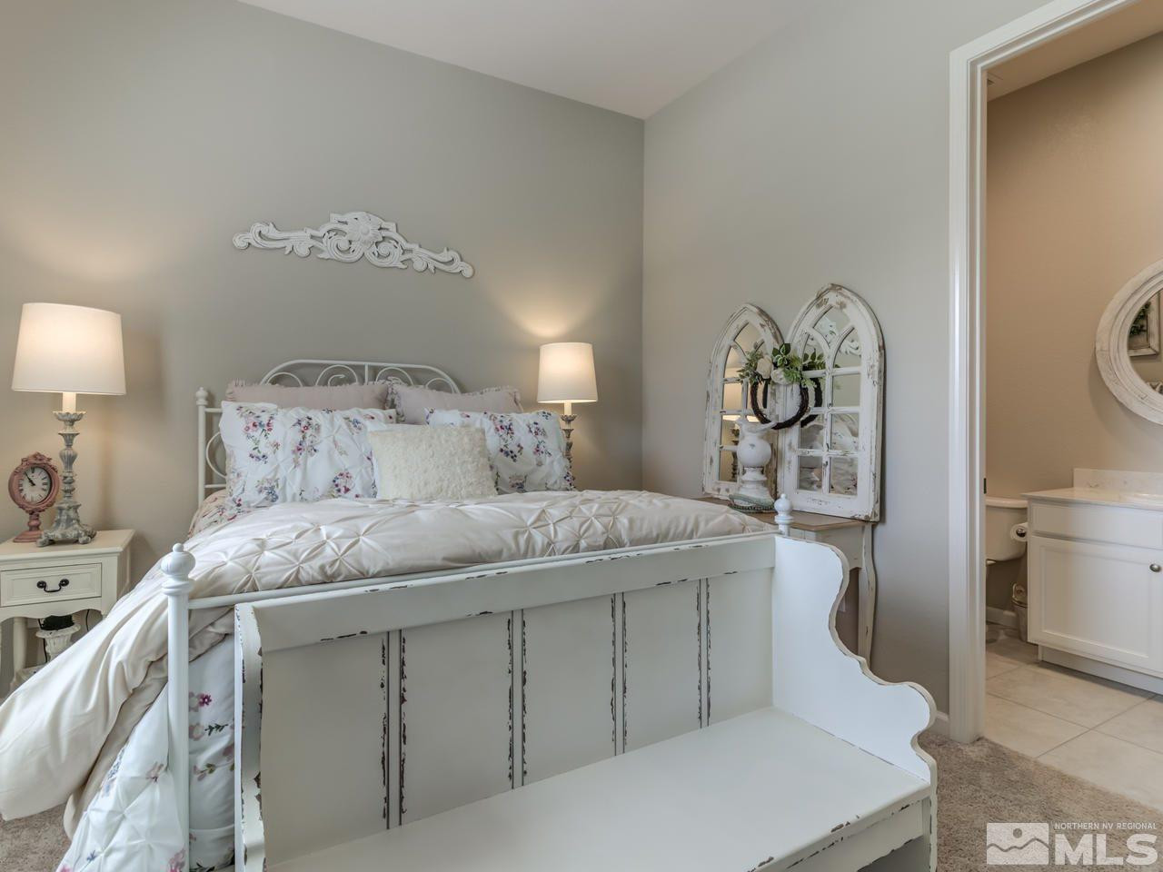 9465 Baldacci Road Reno, NV 89521 - Photo 18 of 25 a bedroom with a bed and a lamp on dresser