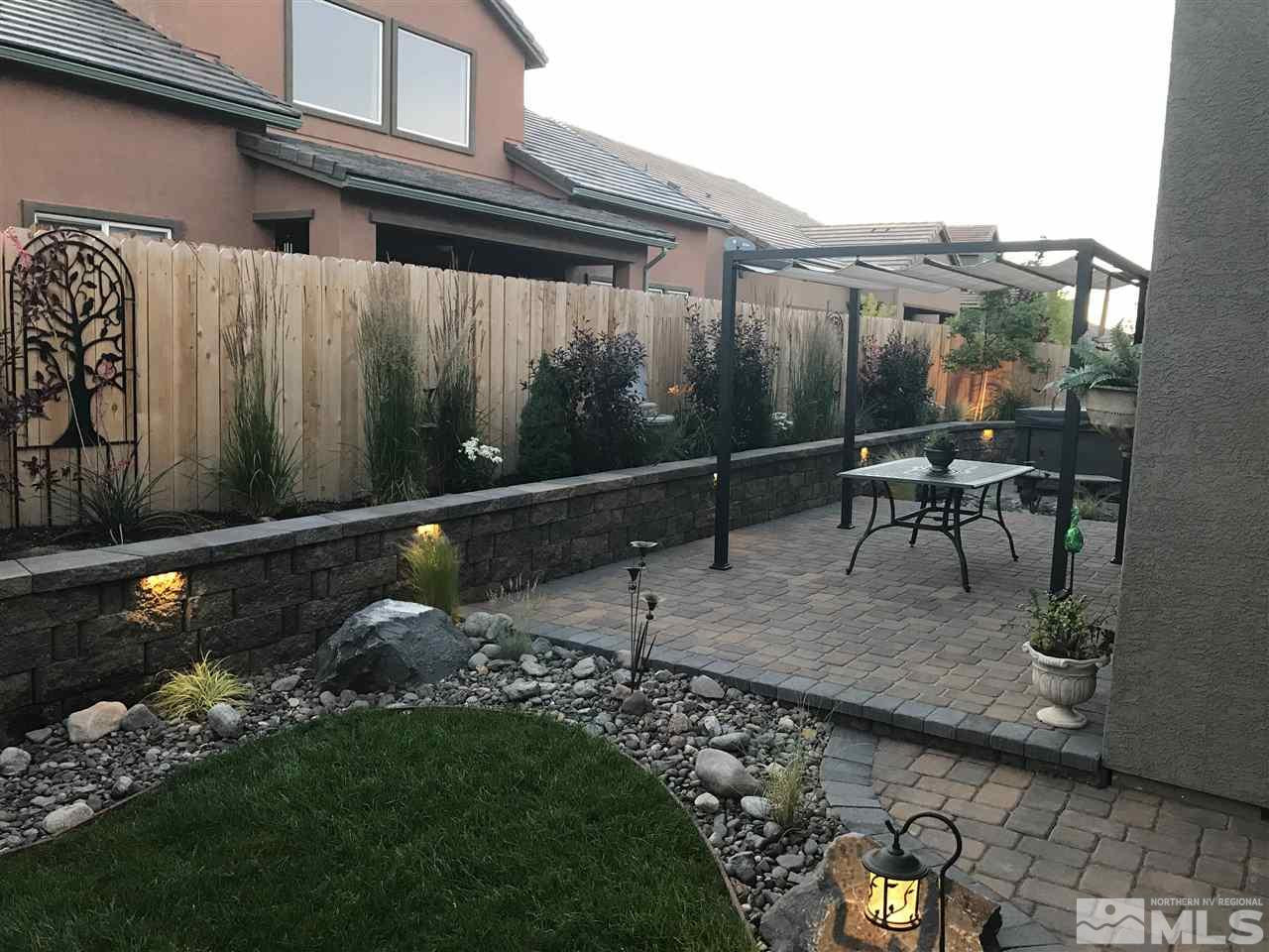 9465 Baldacci Road Reno, NV 89521 - Photo 21 of 25 a view of a patio with table and chairs and potted plants