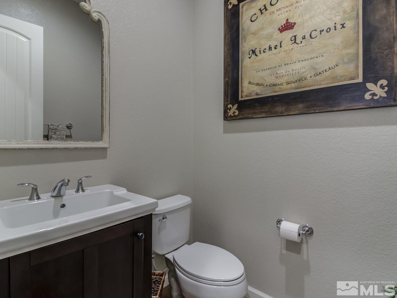 9465 Baldacci Road Reno, NV 89521 - Photo 23 of 25 a bathroom with a toilet sink and mirror