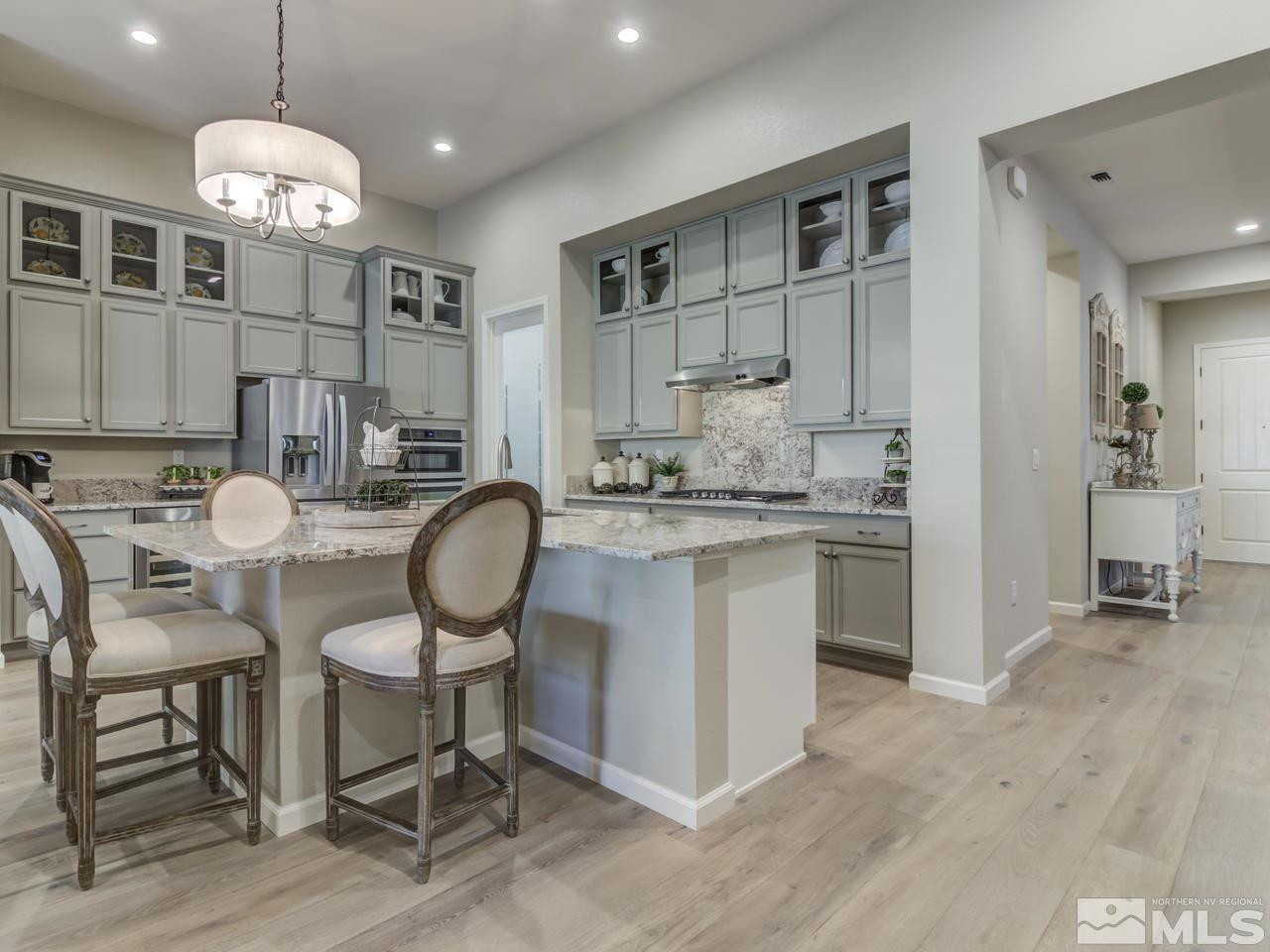 9465 Baldacci Road Reno, NV 89521 - Photo 4 of 25 a kitchen with cabinets and chairs