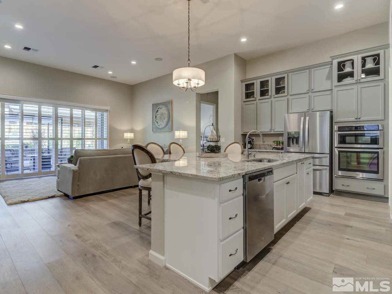 9465 Baldacci Road Reno, NV 89521 - Photo 5 of 25 a large kitchen with stainless steel appliances lots of counter space and breakfast area