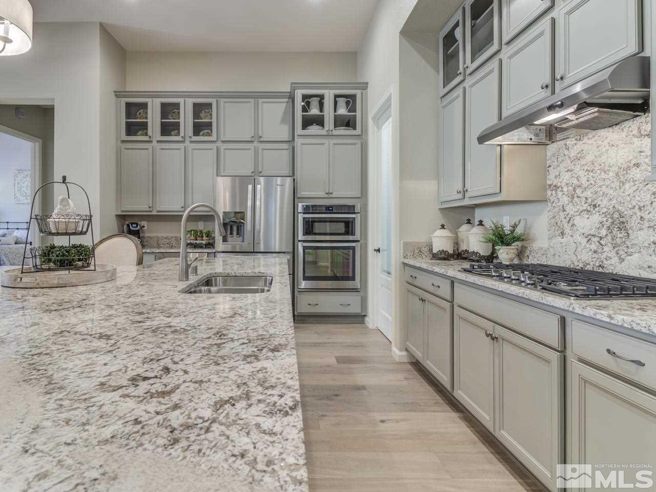 9465 Baldacci Road Reno, NV 89521 - Photo 6 of 25 a kitchen with refrigerator and cabinets