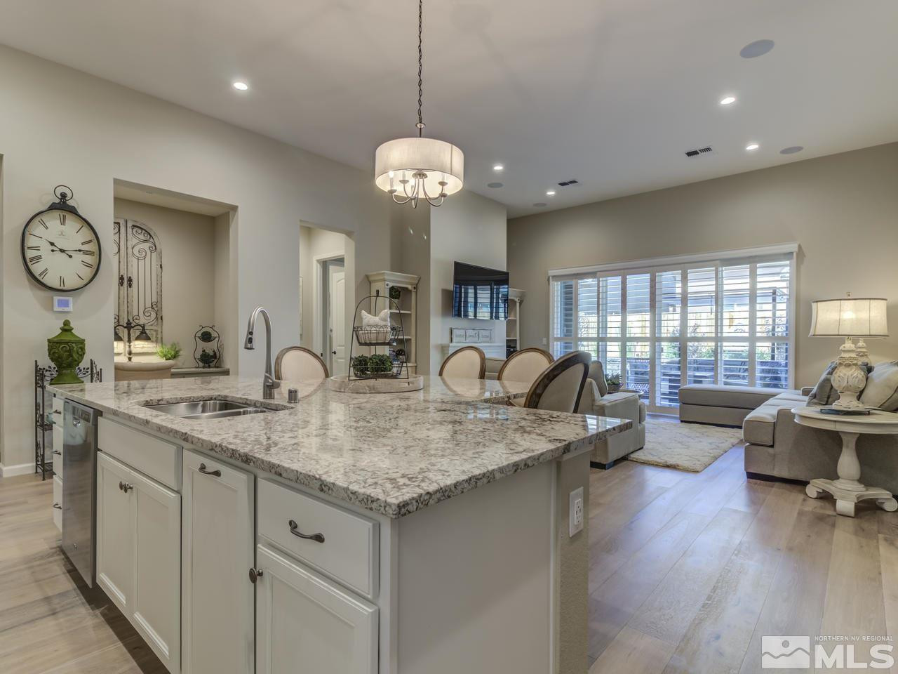 9465 Baldacci Road Reno, NV 89521 - Photo 7 of 25 a very nice looking kitchen with granite countertop a stove oven and a large window