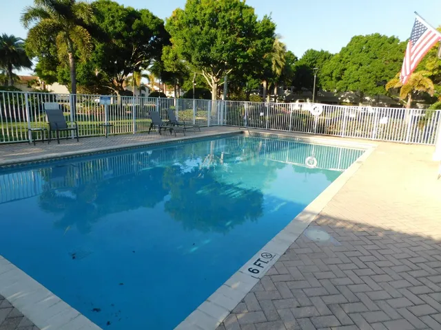 a view of a lake with a house in the background