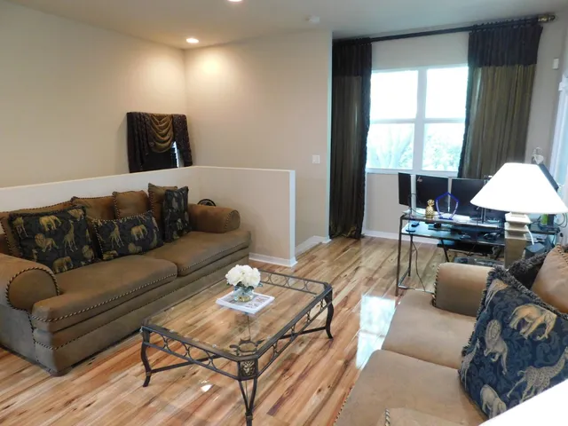 a living room with furniture and a large window