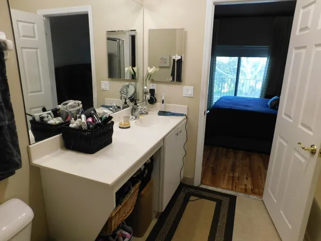 a kitchen with a sink a stove and a window