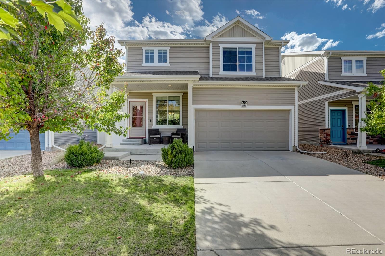 5545 Liverpool Street Denver, CO 80249 - Photo 1 of 40 a front view of a house with garden