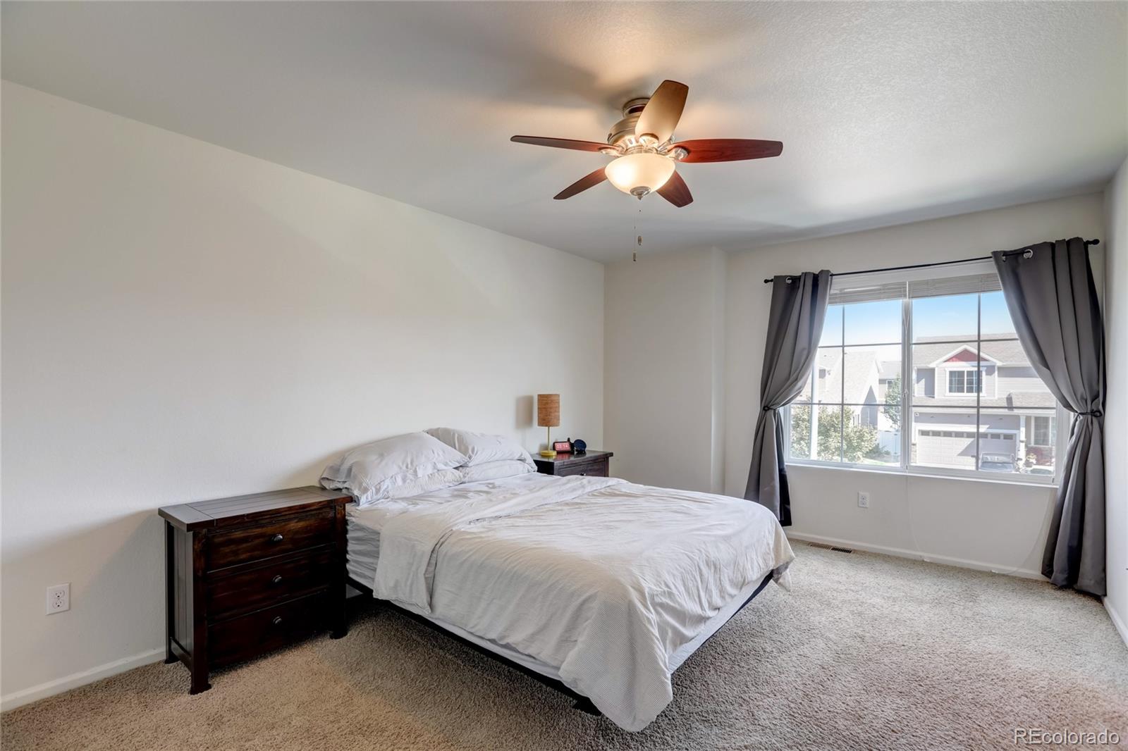 5545 Liverpool Street Denver, CO 80249 - Photo 15 of 40 a bedroom with a bed and a window