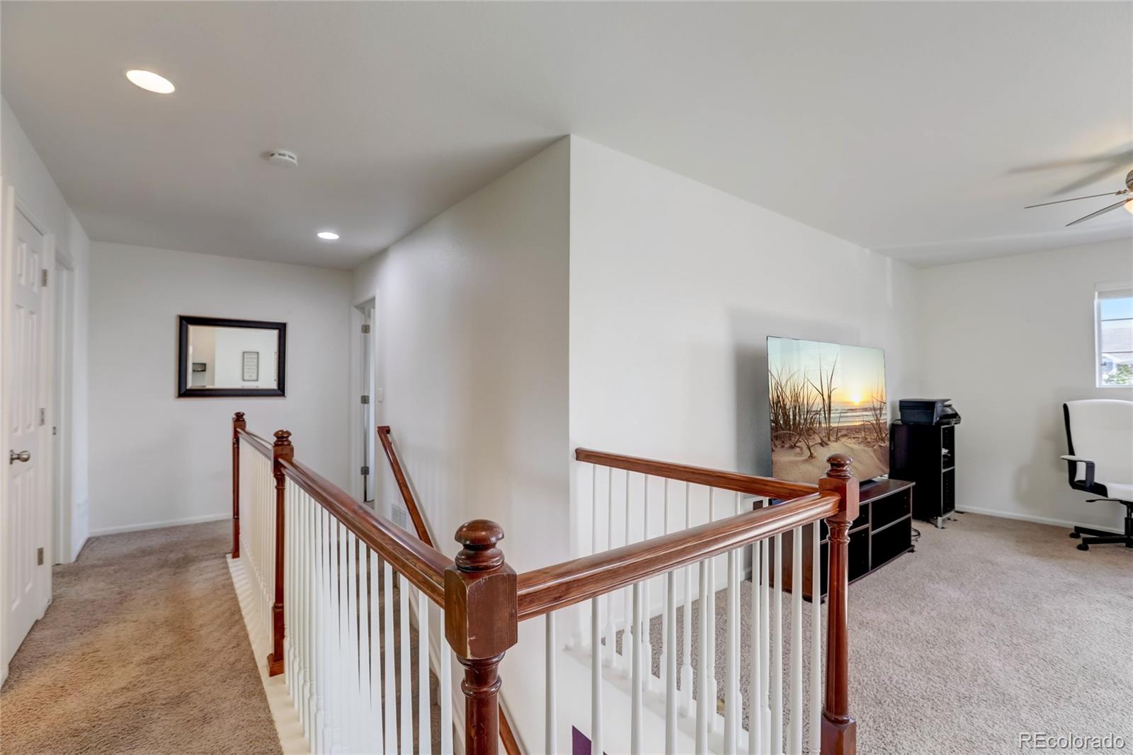 5545 Liverpool Street Denver, CO 80249 - Photo 20 of 40 a view of a hallway with workspace