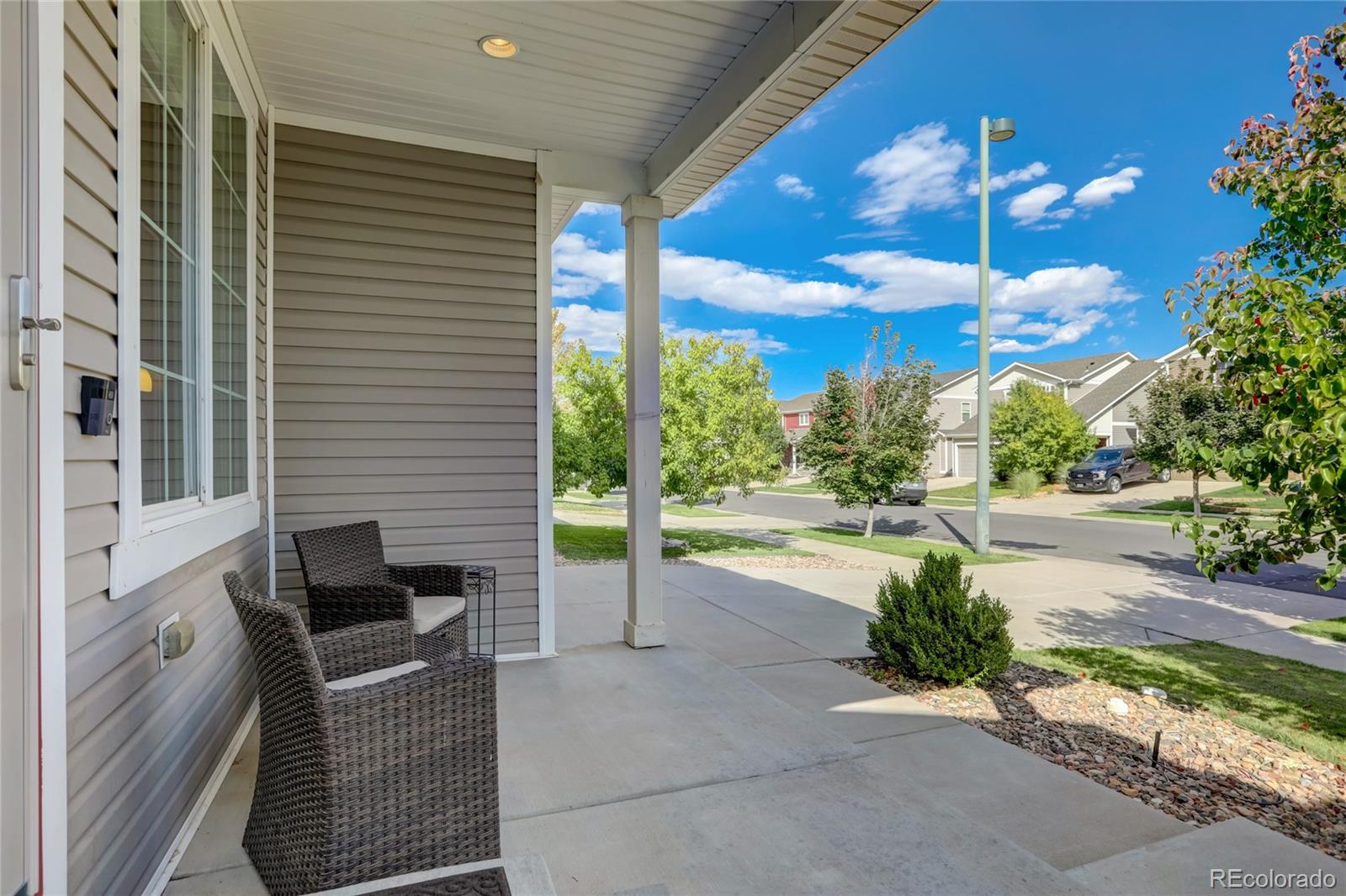 5545 Liverpool Street Denver, CO 80249 - Photo 2 of 40 a view of a patio with a table and chairs