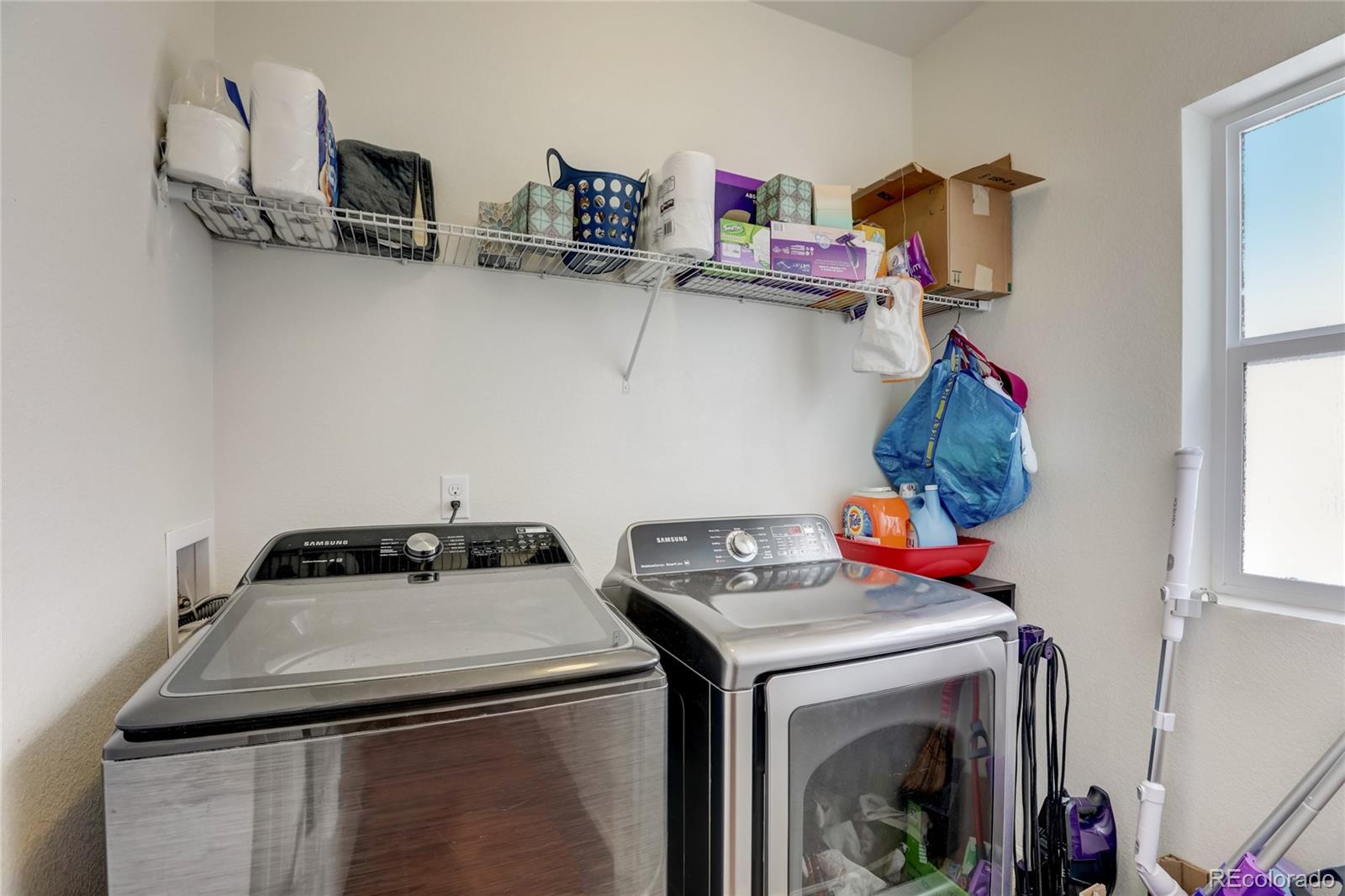 5545 Liverpool Street Denver, CO 80249 - Photo 30 of 40 a utility room with dryer and washer