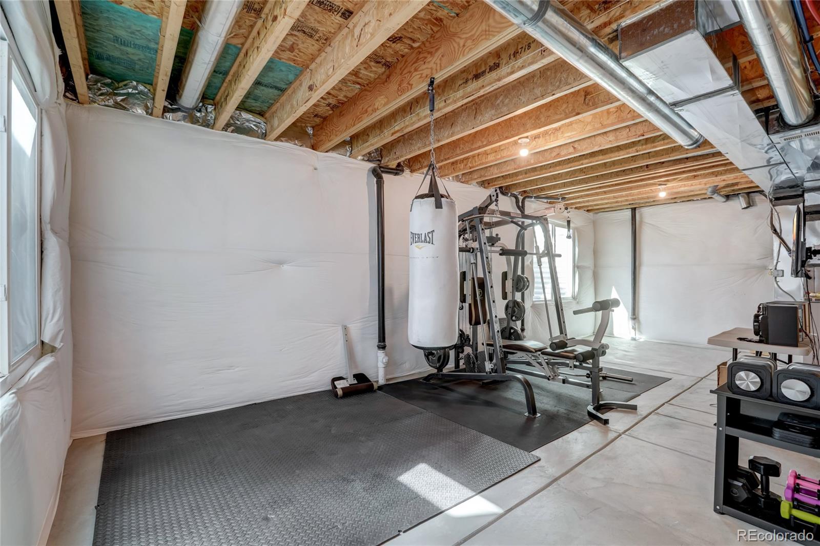 5545 Liverpool Street Denver, CO 80249 - Photo 31 of 40 a view of a room with gym equipment