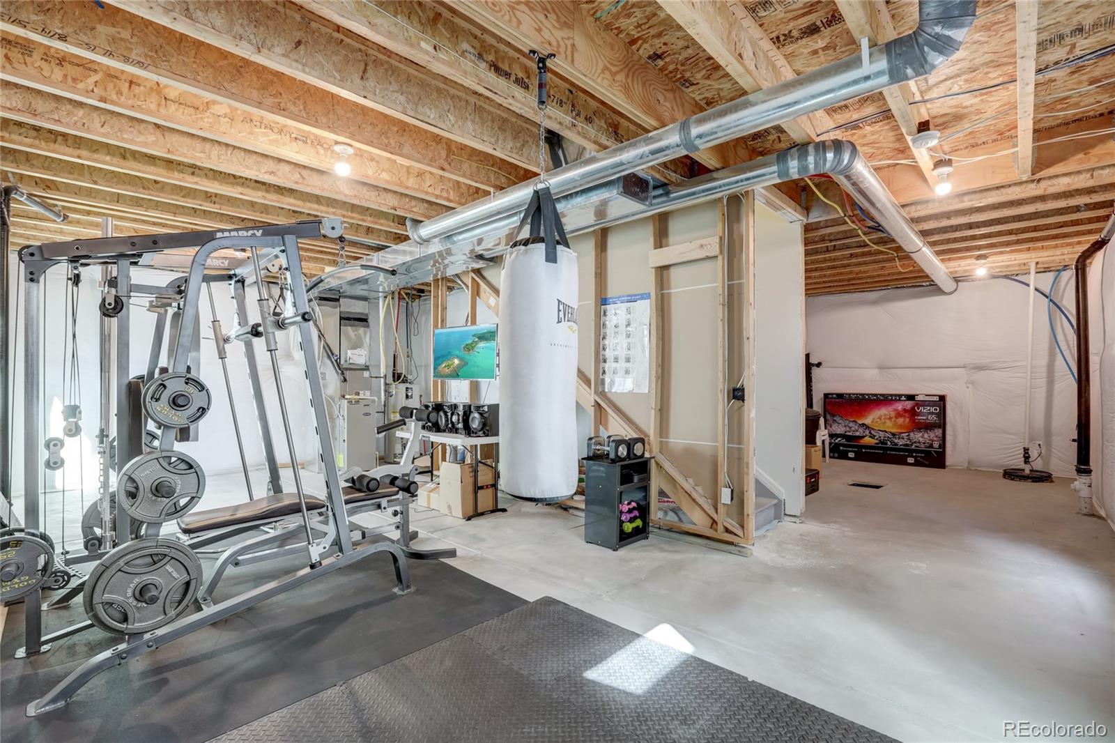 5545 Liverpool Street Denver, CO 80249 - Photo 32 of 40 a view of a room with gym equipment