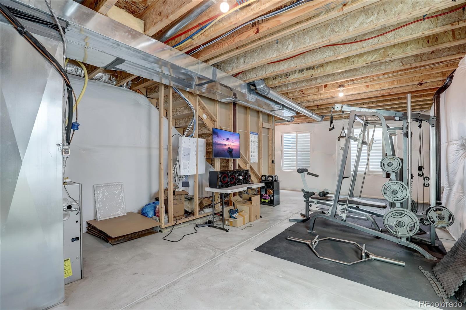 5545 Liverpool Street Denver, CO 80249 - Photo 33 of 40 a view of a room with gym equipment