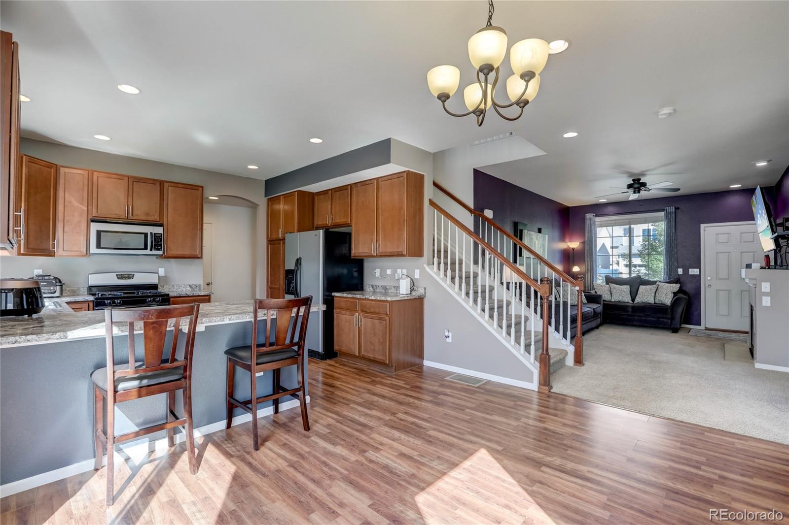 5545 Liverpool Street Denver, CO 80249 - Photo 10 of 40 a view of kitchen with furniture and a chandelier