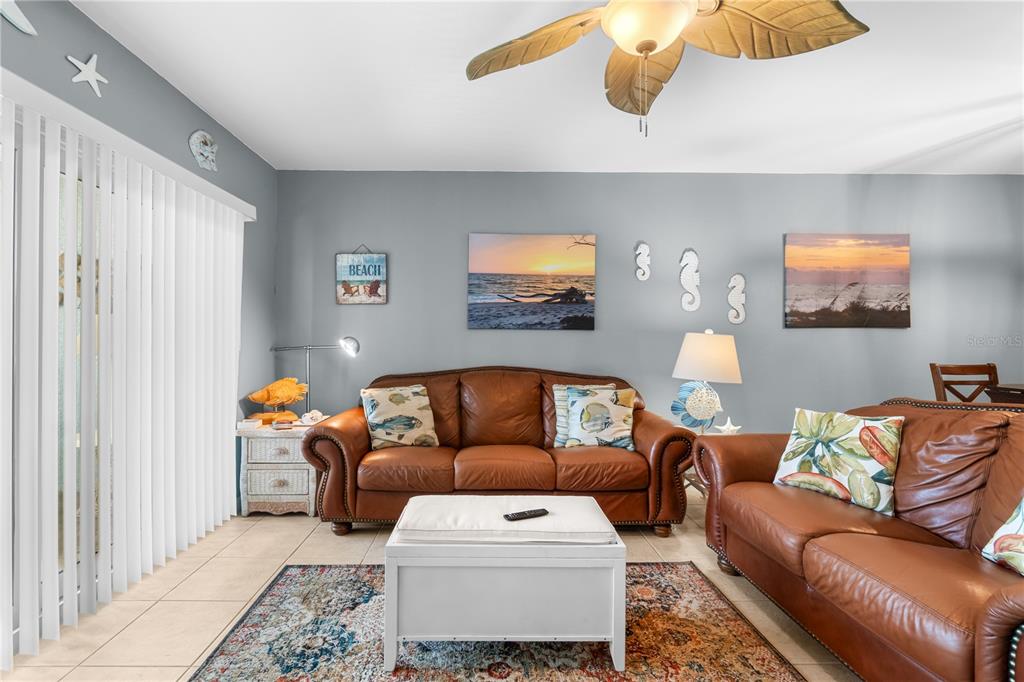 8405 Placida Road, Unit 206 Placida, FL 33946 - Photo 11 of 44 a living room with furniture and a flat screen tv