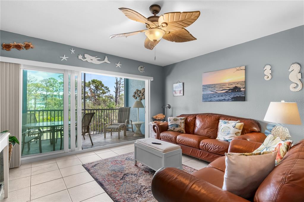 8405 Placida Road, Unit 206 Placida, FL 33946 - Photo 13 of 44 a living room with furniture and a large window