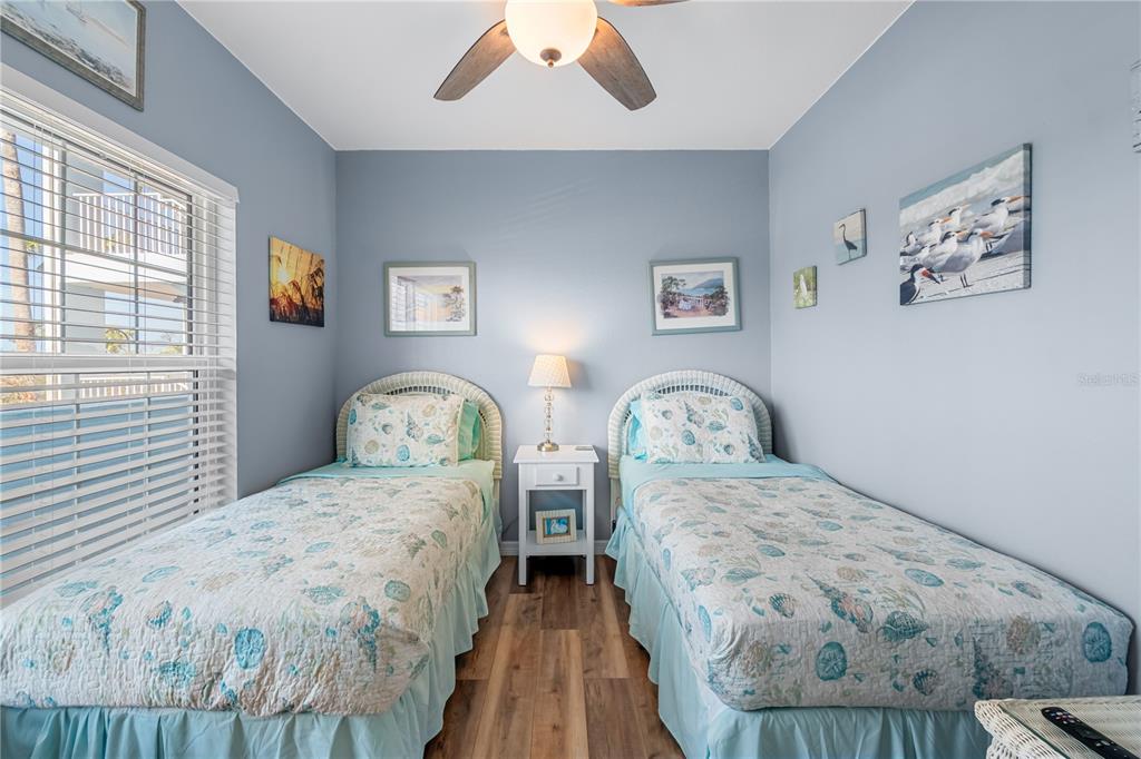 8405 Placida Road, Unit 206 Placida, FL 33946 - Photo 19 of 44 a bedroom with double bed and a wooden floor