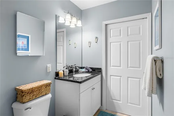 a bathroom with a sink a vanity and a mirror