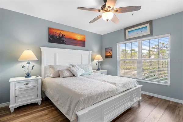 a bedroom with bed and a window