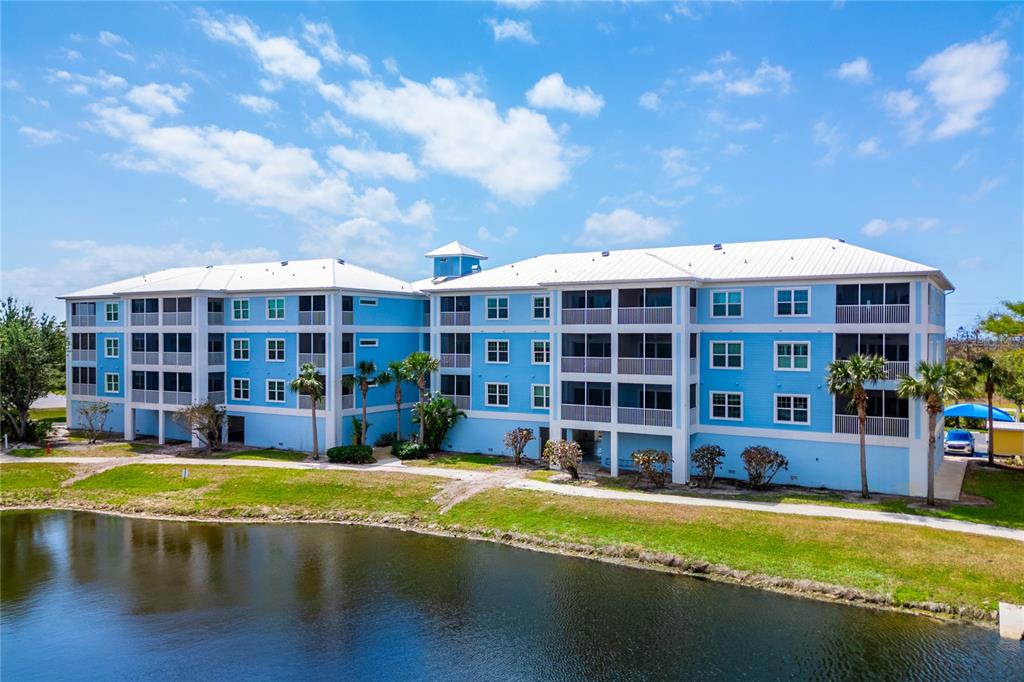 8405 Placida Road, Unit 206 Placida, FL 33946 - Photo 39 of 44 a view of swimming pool with outdoor seating