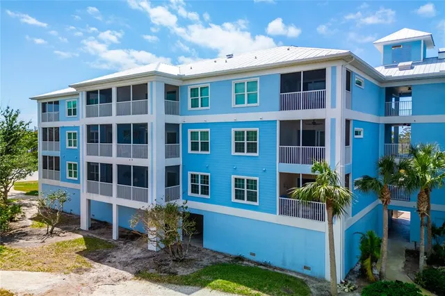 a view of a brick building next to a yard