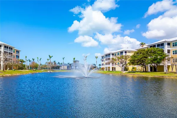 a view of a swimming pool with an outdoor space and seating area