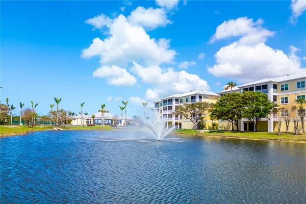 an aerial view of a house with a lake view