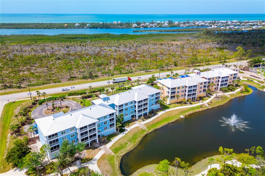 8405 Placida Road, Unit 206 Placida, FL 33946 - Photo 43 of 44 an aerial view of a house with a lake view
