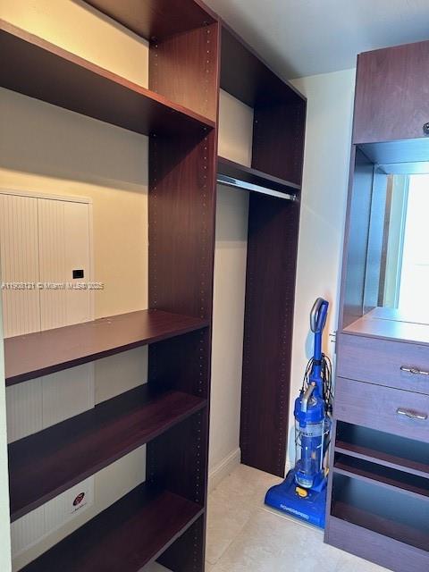 185 Southwest 7th Street, Unit 2300 Miami, FL 33130 - Photo 9 of 9 a view of walk in closet with clothes