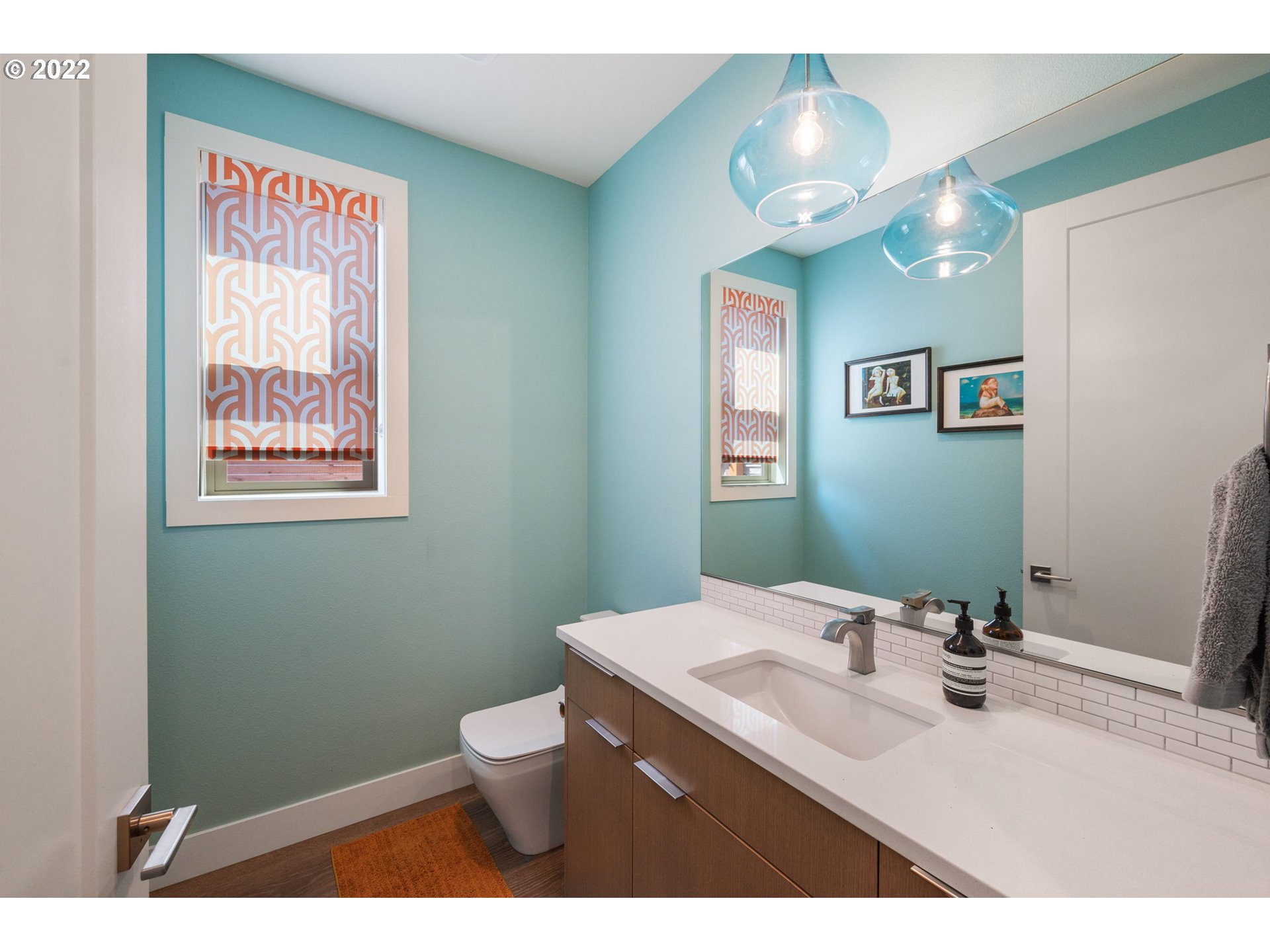 3865 Northwest Celebration Lane Camas, WA 98607 - Photo 13 of 32 a bathroom with a sink a toilet and a mirror